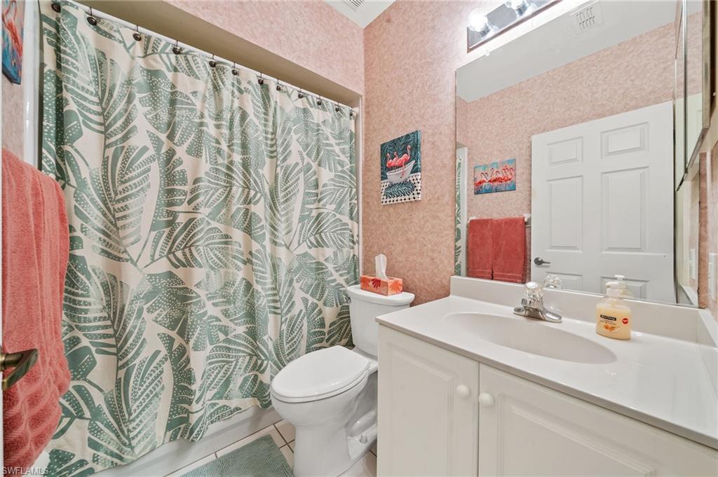 14771 Hole In 1 Circle, Unit 108 Fort Myers, FL 33919 - Photo 12 of 22 a bathroom with a sink toilet and shower