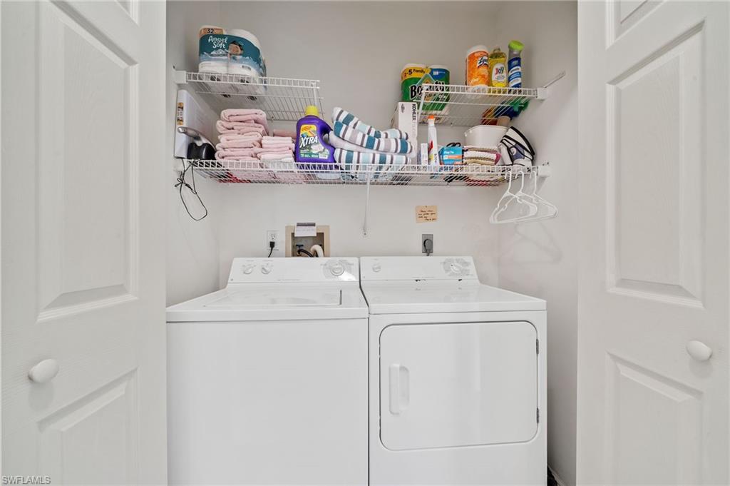 14771 Hole In 1 Circle, Unit 108 Fort Myers, FL 33919 - Photo 13 of 22 a utility room with dryer and washer