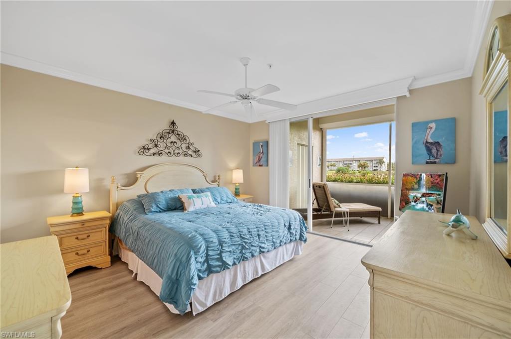 14771 Hole In 1 Circle, Unit 108 Fort Myers, FL 33919 - Photo 14 of 22 a bedroom with a bed couch and a window