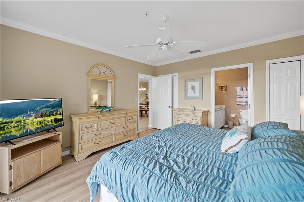 14771 Hole In 1 Circle, Unit 108 Fort Myers, FL 33919 - Photo 15 of 22 a bedroom with a bed and a dresser