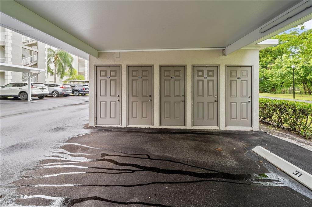 14771 Hole In 1 Circle, Unit 108 Fort Myers, FL 33919 - Photo 2 of 22 a view of a car park in front of a house
