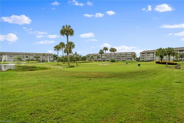 a view of a big yard with a fountain