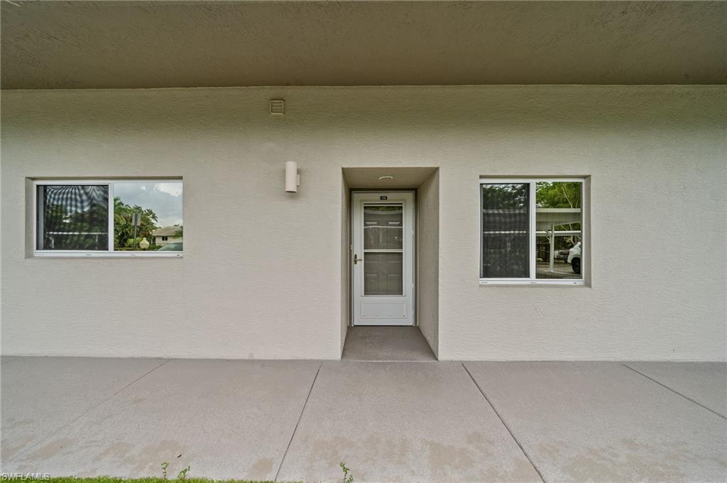 14771 Hole In 1 Circle, Unit 108 Fort Myers, FL 33919 - Photo 3 of 22 a view of an empty room with a window