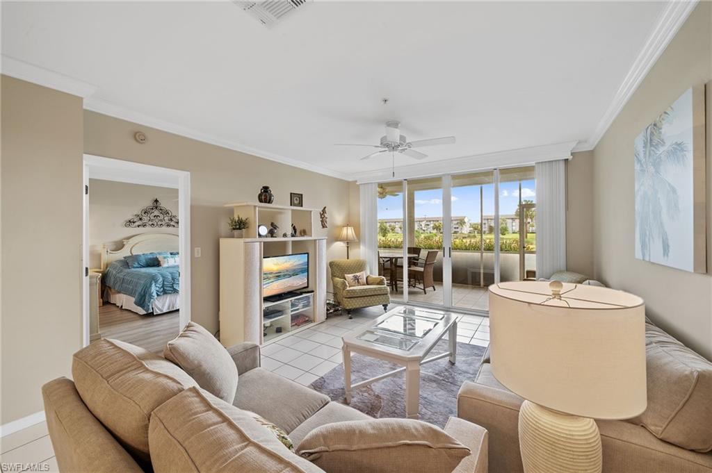 14771 Hole In 1 Circle, Unit 108 Fort Myers, FL 33919 - Photo 4 of 22 a living room with furniture and a wooden floor