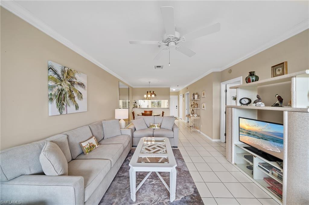 14771 Hole In 1 Circle, Unit 108 Fort Myers, FL 33919 - Photo 5 of 22 a living room with furniture and a flat screen tv