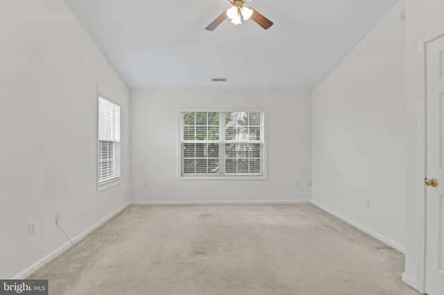 a bath tub sitting in a bathroom next to a window
