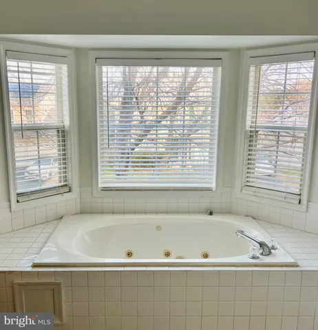 a bathroom with a bathtub and a sink