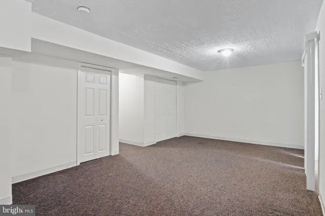 a picture of a bathroom with a shower