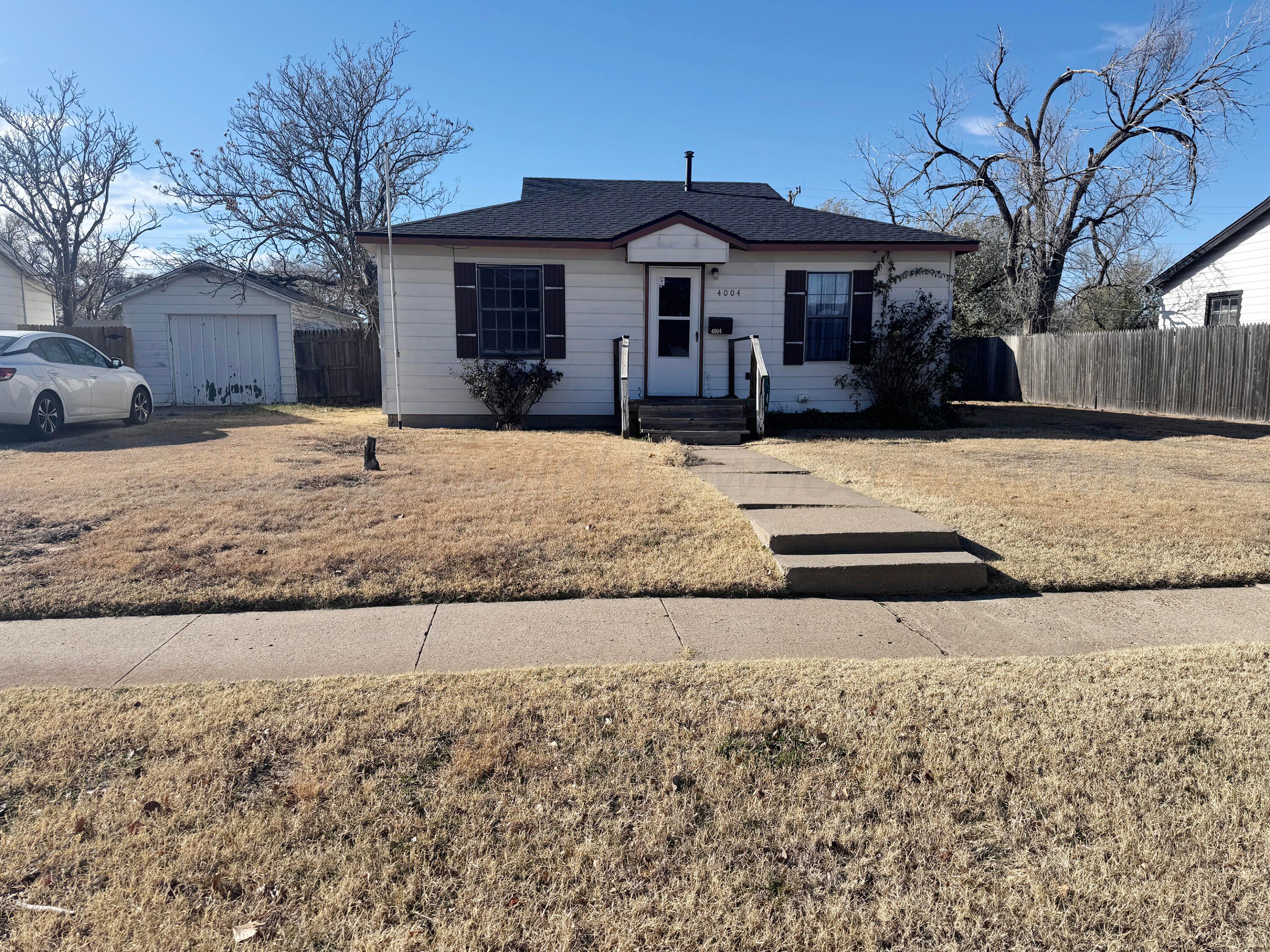 4004 South Hayden Street Amarillo, TX 79110 - Photo 2 of 14 a front view of a house with a yard