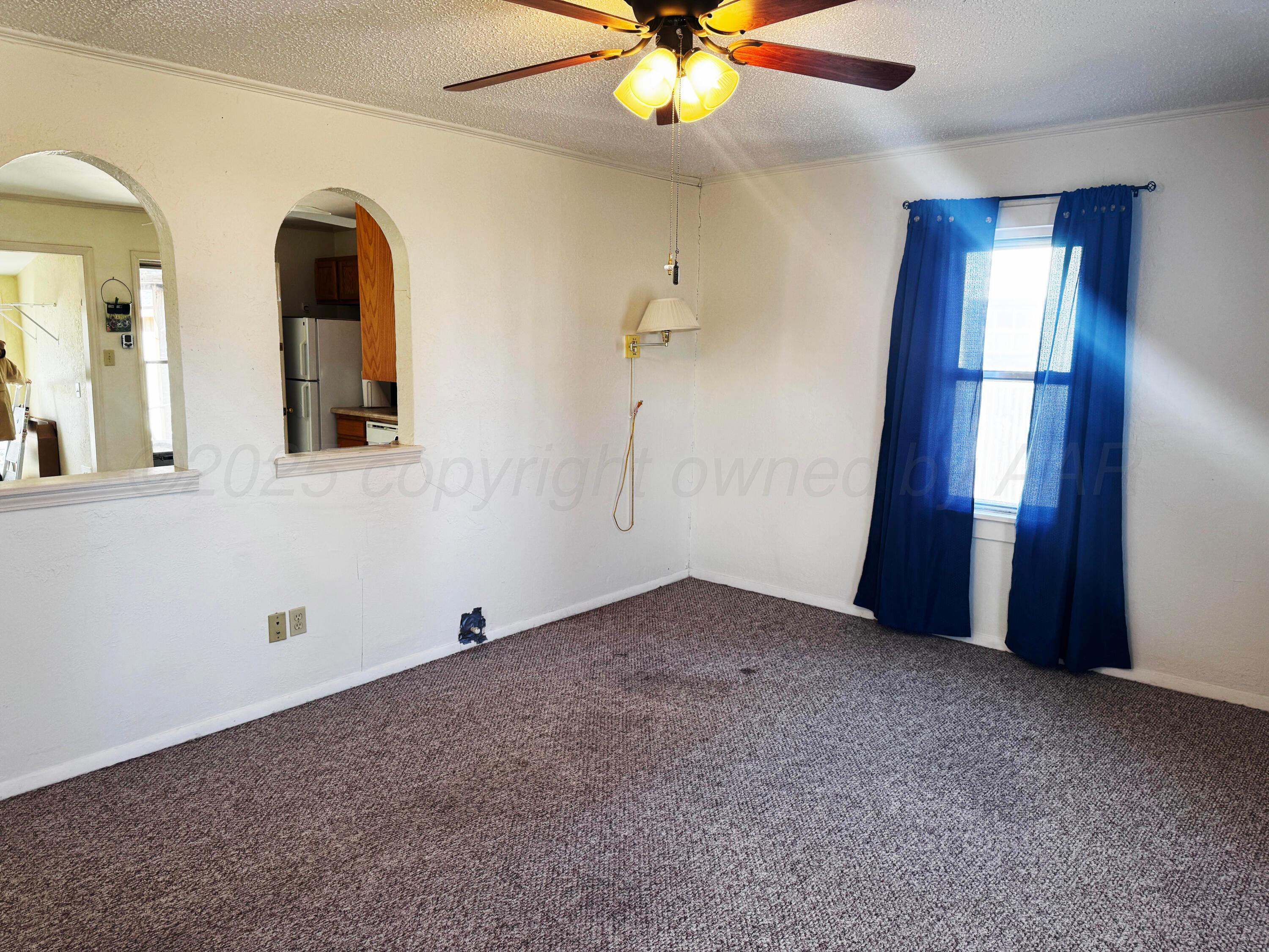 4004 South Hayden Street Amarillo, TX 79110 - Photo 3 of 14 a view of empty room with window