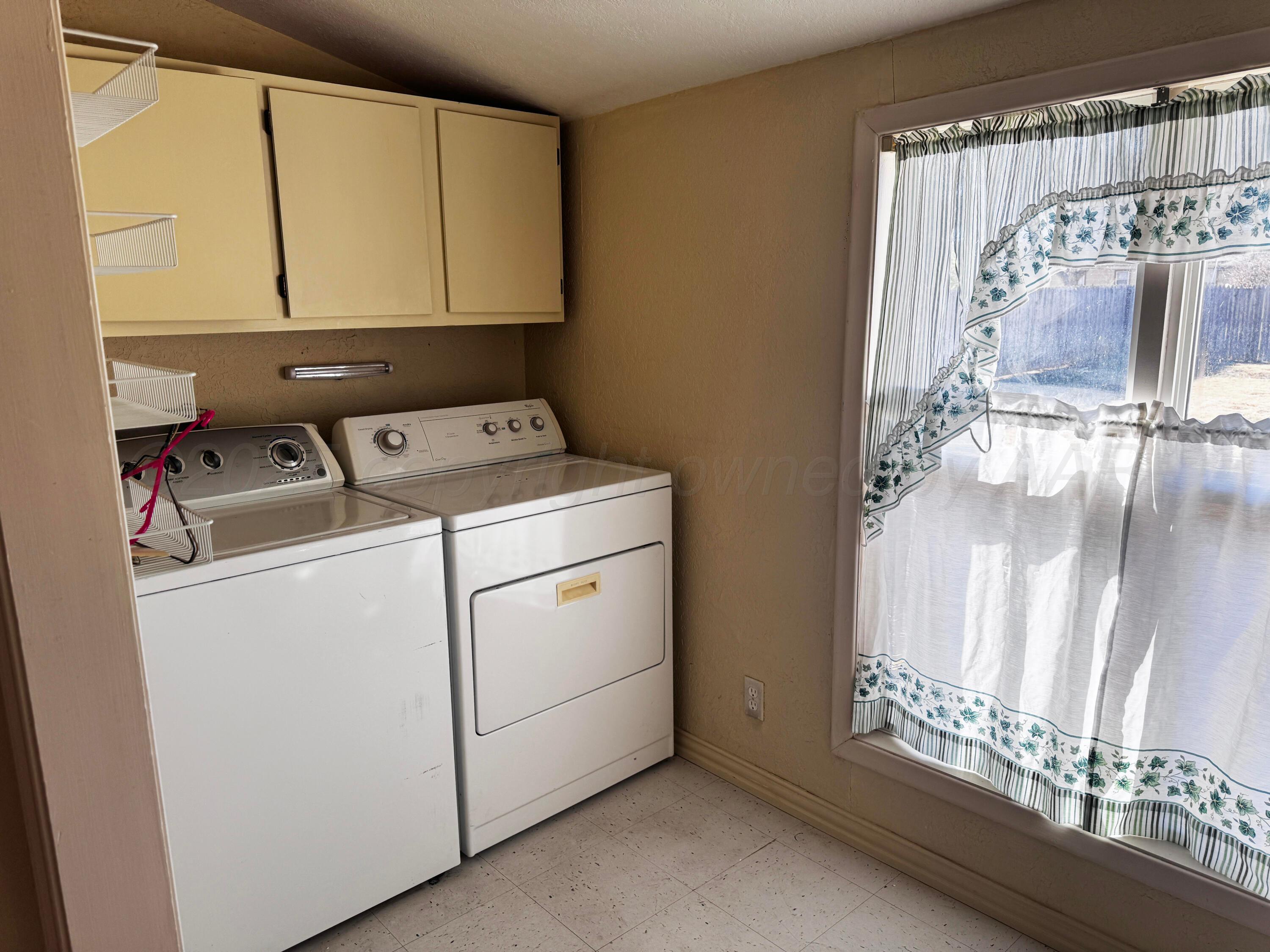 4004 South Hayden Street Amarillo, TX 79110 - Photo 7 of 14 a utility room with dryer and washer