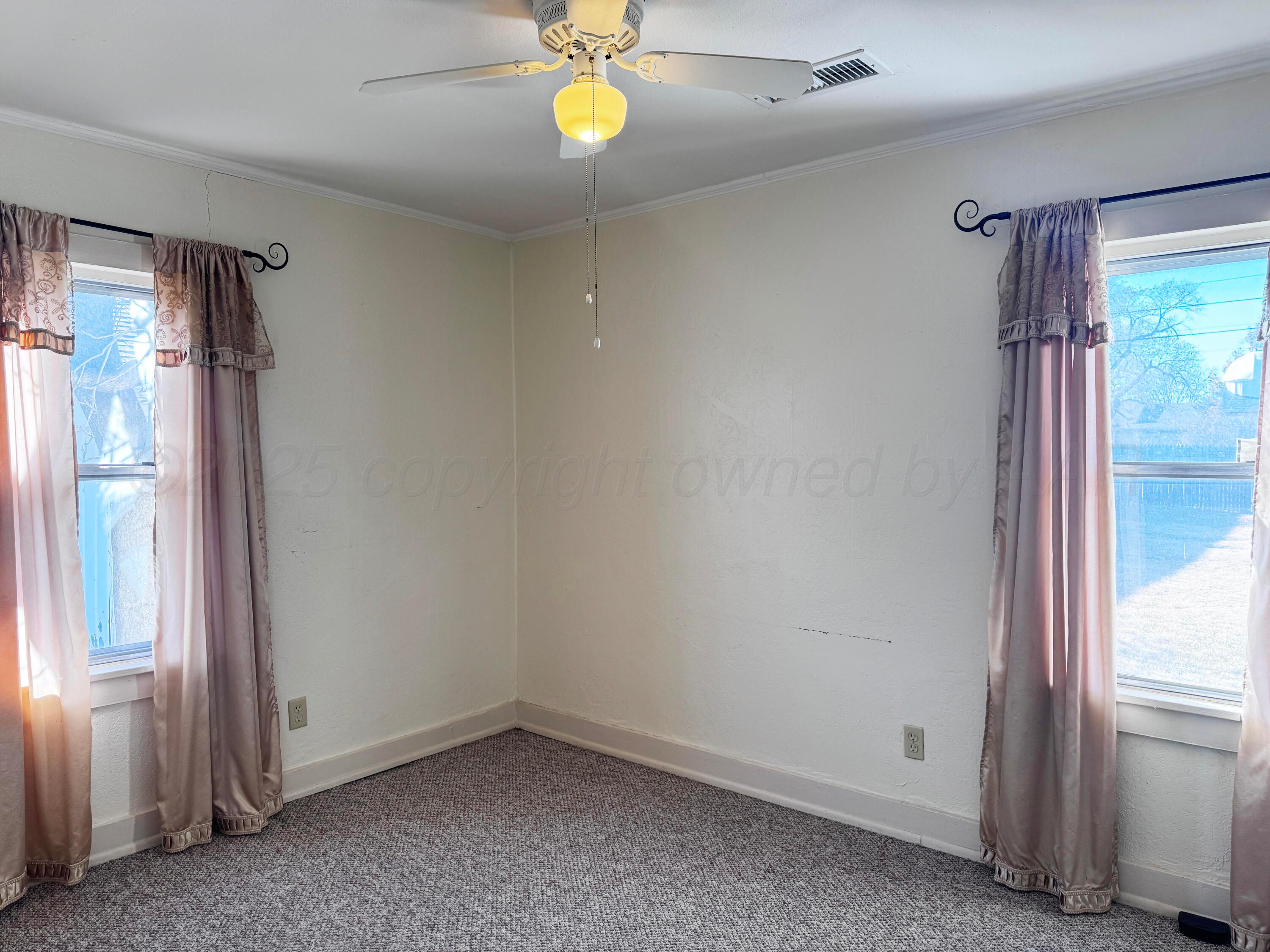 4004 South Hayden Street Amarillo, TX 79110 - Photo 10 of 14 a view of an empty room with a window