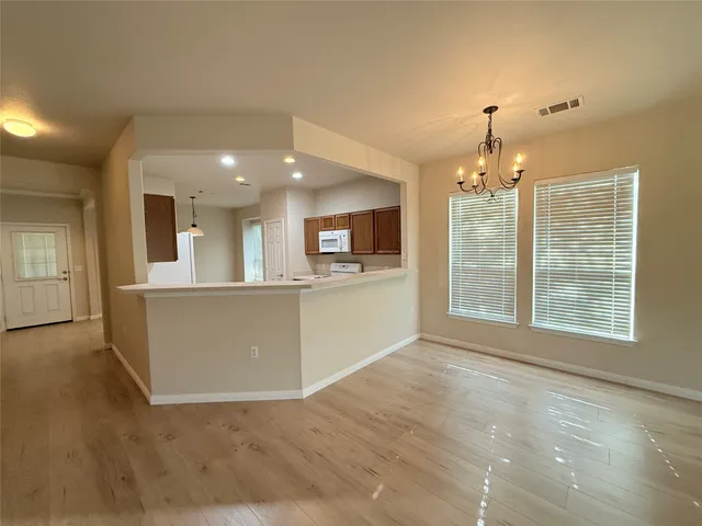 a view of a kitchen with a sink and a window