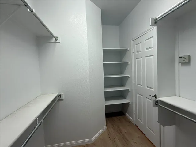 a view of an empty walk in closet