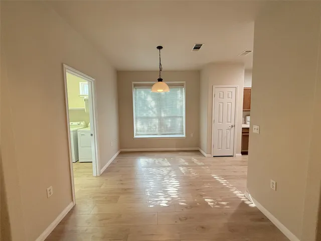 a view of a windows and chandelier in a room