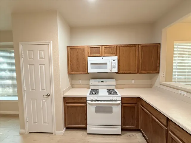 a kitchen with a stove and a sink