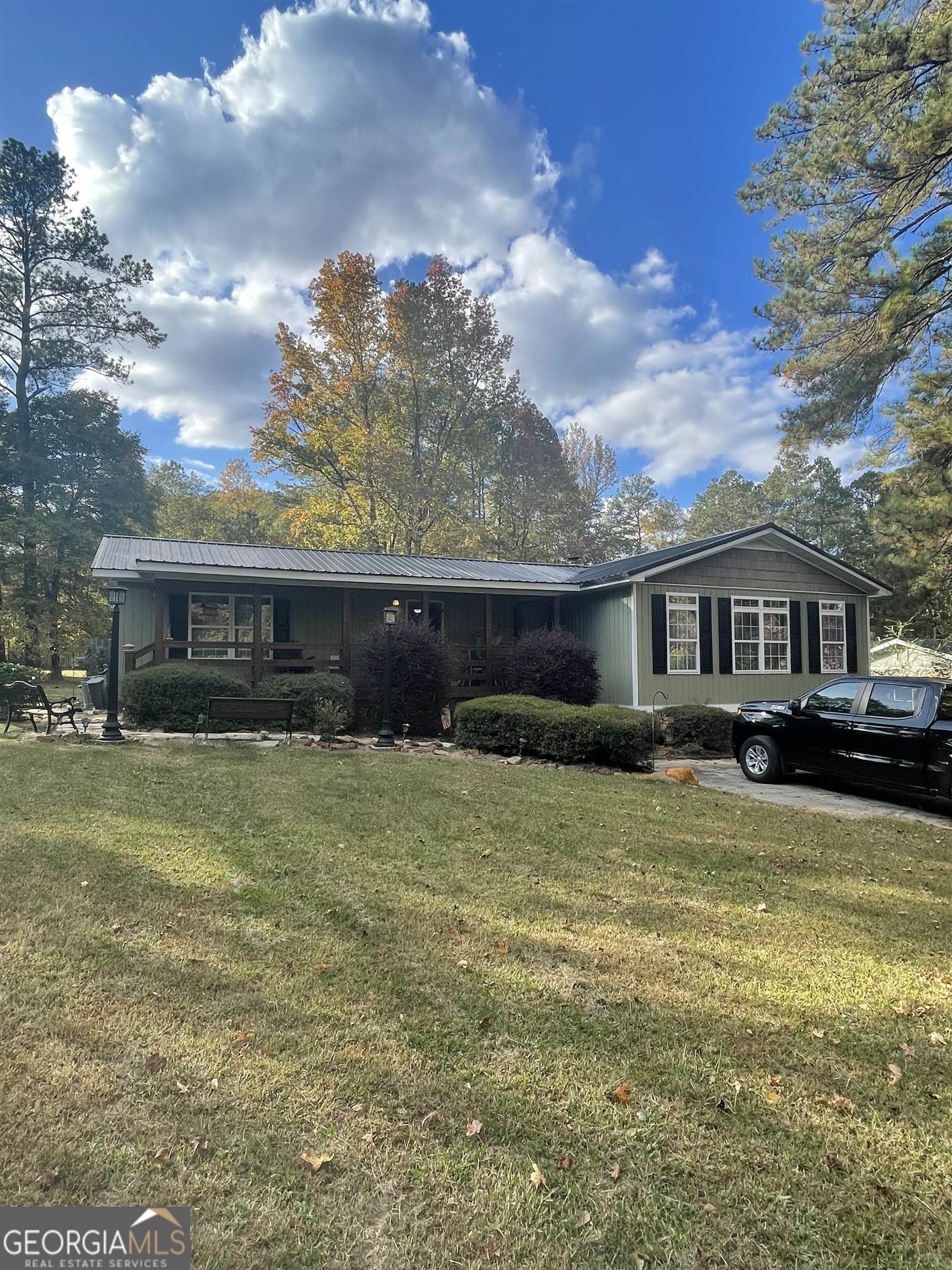 588 East Lake Buckhorn Road Temple, GA 30179 - Photo 1 of 1 a front view of a house with a yard