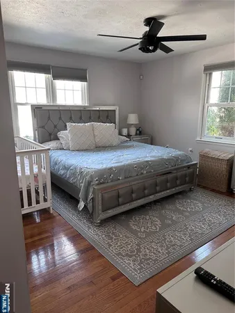 a bedroom with bed and window