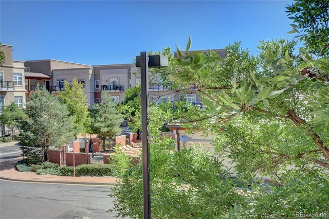 a flower garden is sitting in front of a building