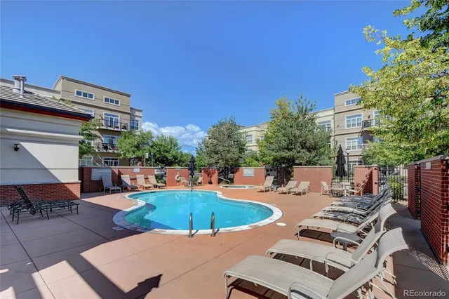 a view of a patio with swimming pool