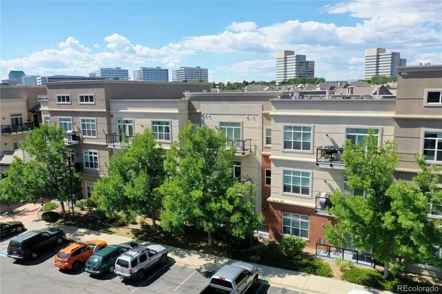 a car parked in front of a brick house