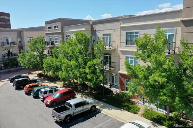 a car parked in front of a brick house