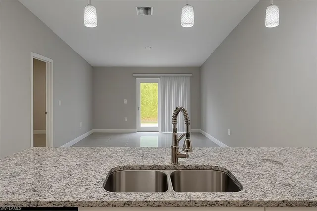 a kitchen with a sink and a window