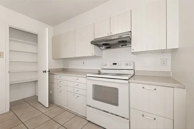 a bathroom with a sink a vanity and a large mirror