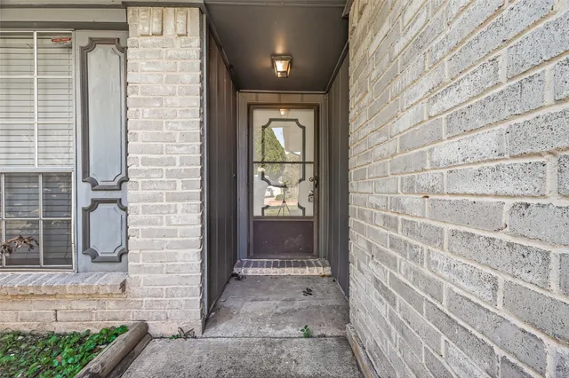 a view of an empty room with a fireplace