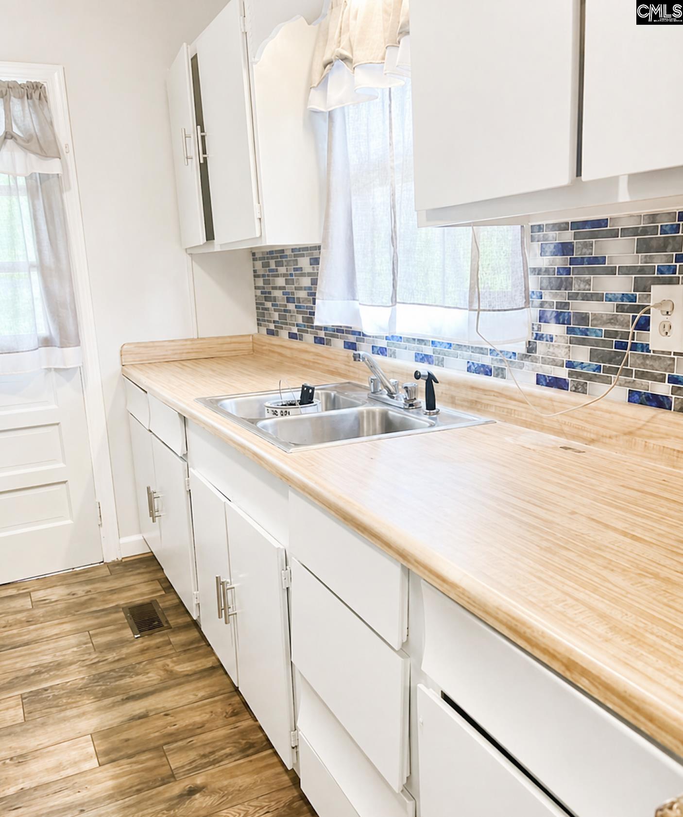 118 State Rd S-38-1224 Cordova, SC 29039 - Photo 6 of 12 a bathroom with a sink and a window