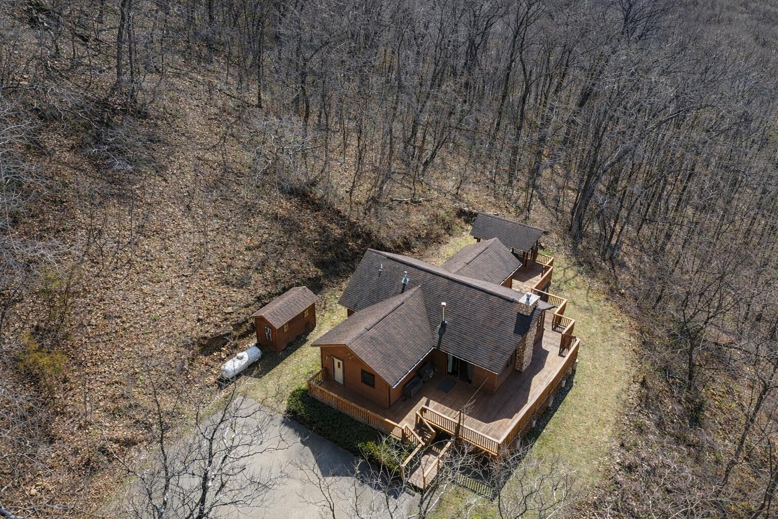 57751 Rainbow Drive Freeman, WI 54628 - Photo 31 of 32 Rustic cabin in the forest clearing
