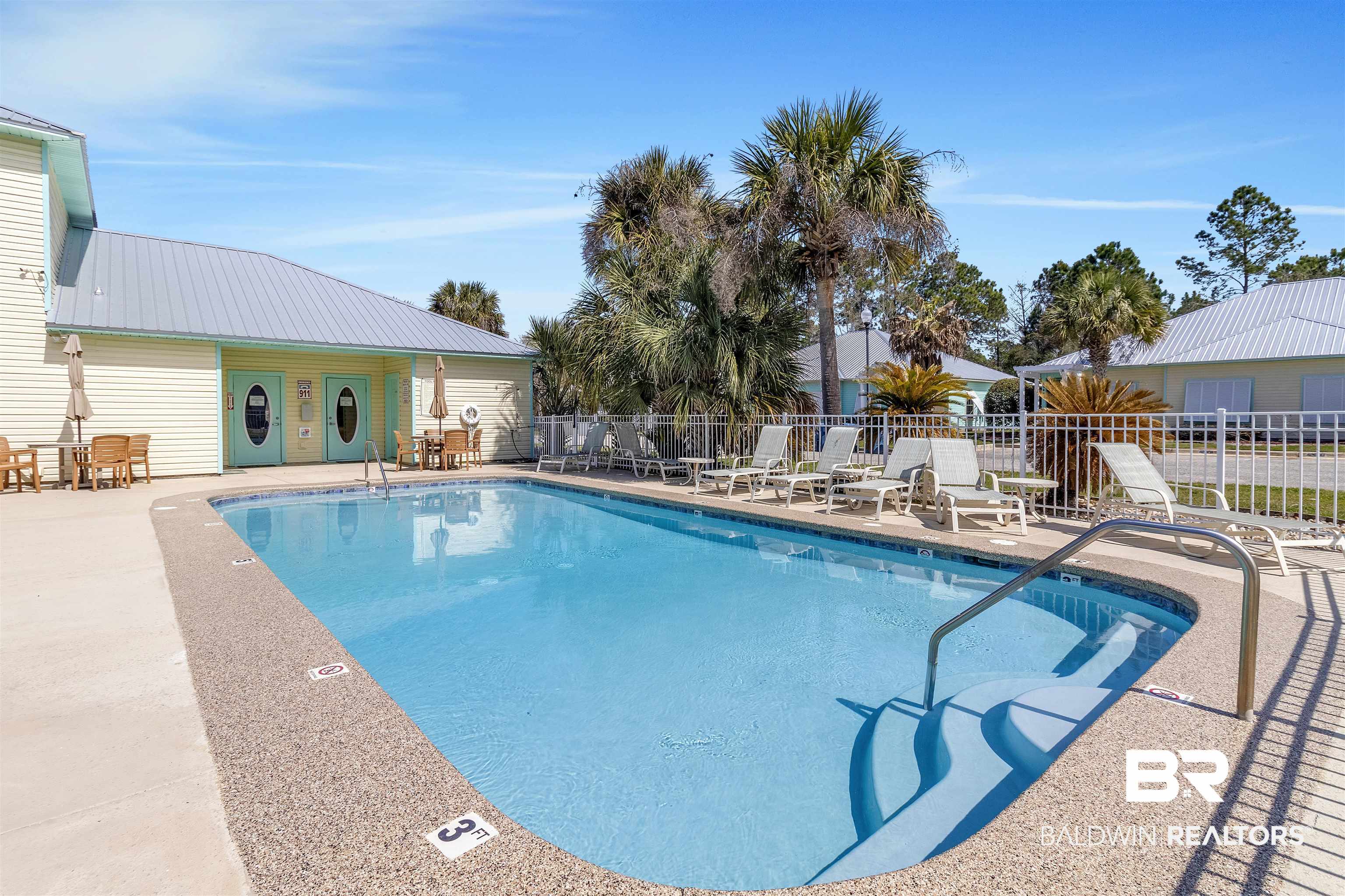 4324 B Lindsey Lane, Unit 4324B Orange Beach, AL 36561 - Photo 20 of 33 Community pool featuring a patio area and fence