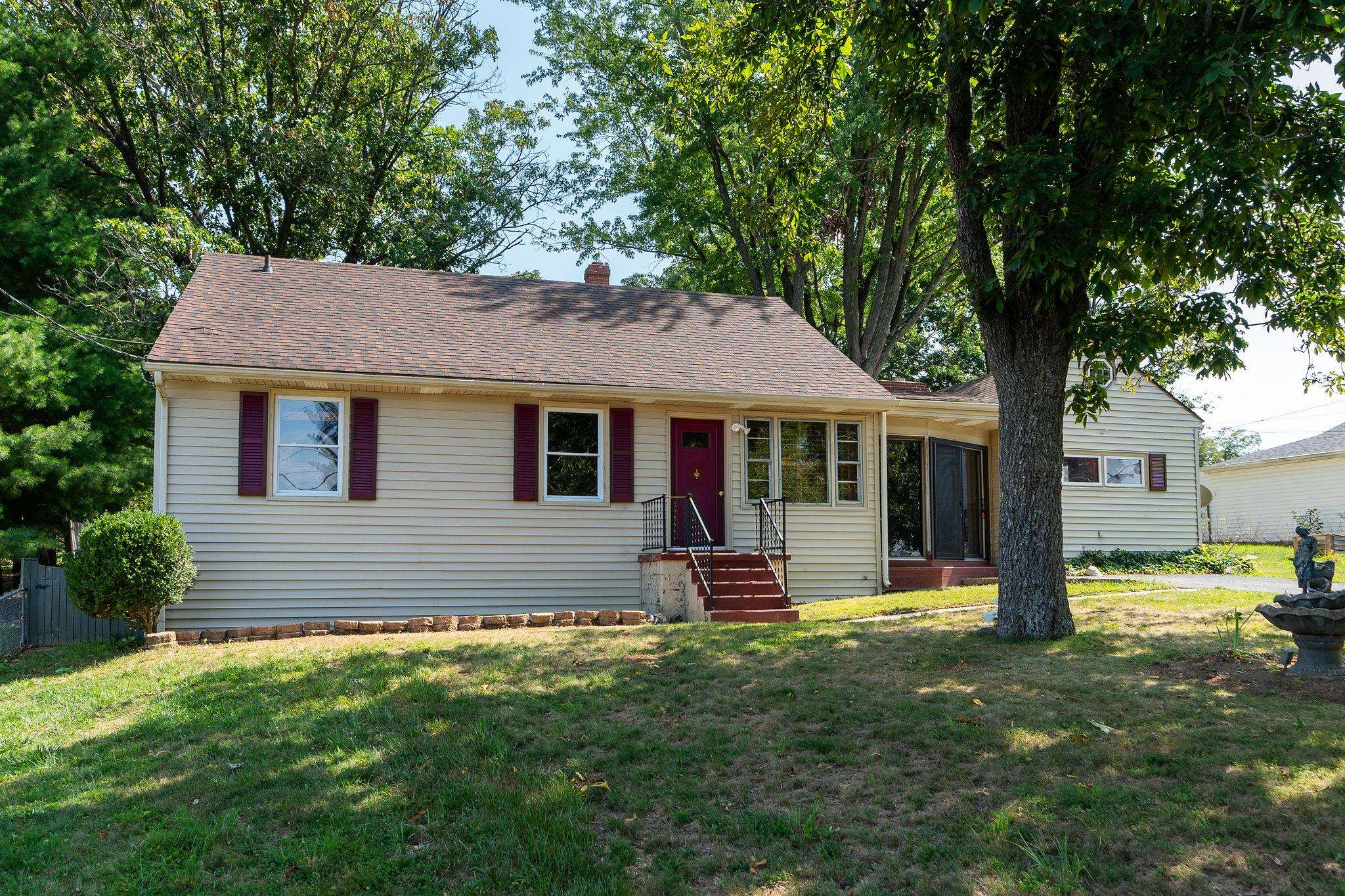 205 Devon Road Staunton, VA 24401 - Photo 4 of 71 a front view of a house with a garden and trees