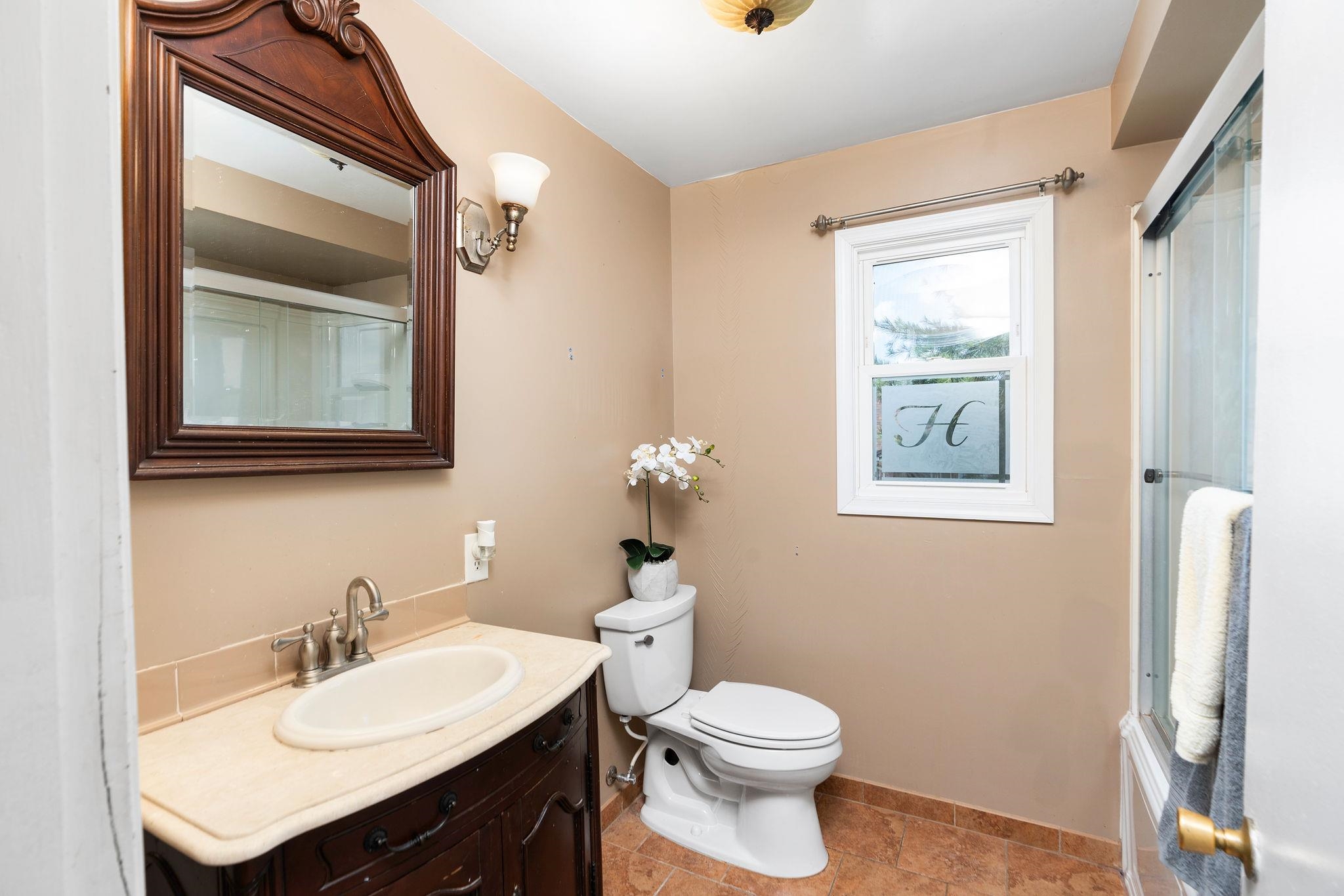 205 Devon Road Staunton, VA 24401 - Photo 42 of 71 a bathroom with a sink vanity and a toilet