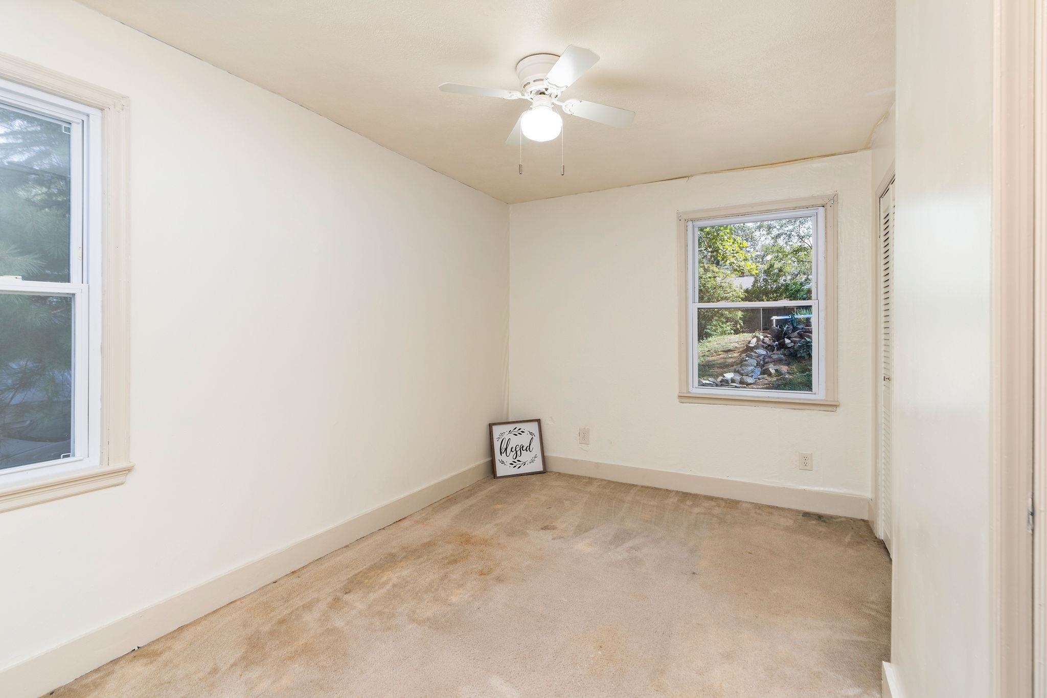 205 Devon Road Staunton, VA 24401 - Photo 44 of 71 an empty room with a window and ceiling fan