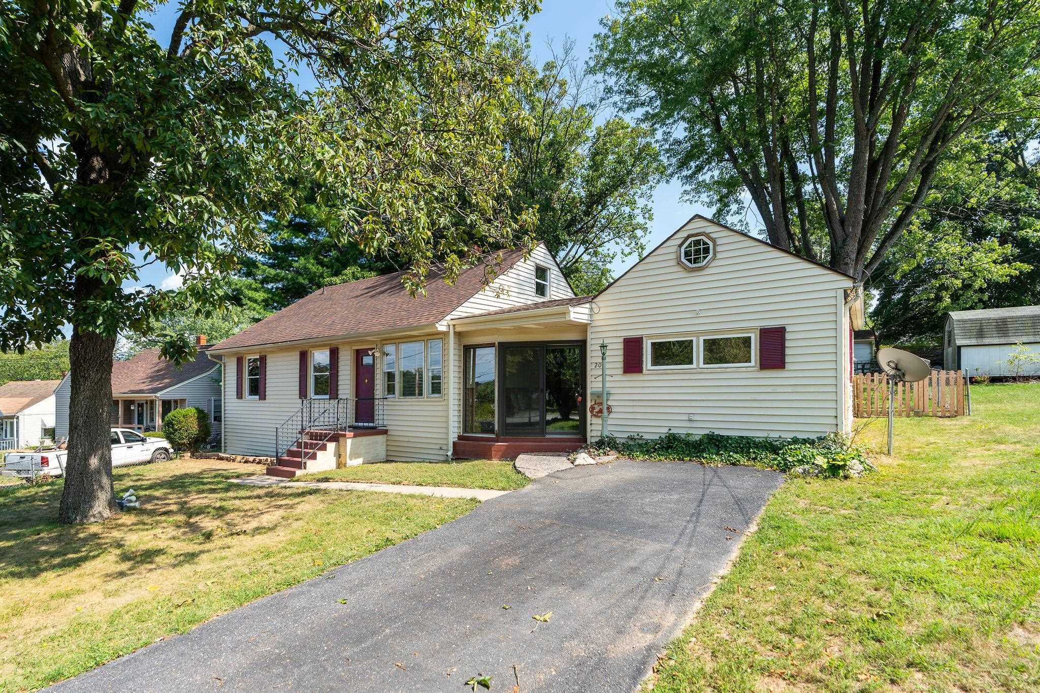 205 Devon Road Staunton, VA 24401 - Photo 6 of 71 a front view of a house with a yard table and chairs
