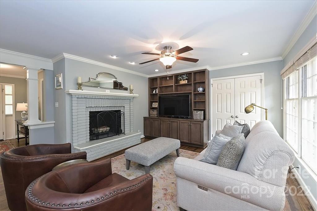 3100 Mountainbrook Road Charlotte, NC 28210 - Photo 12 of 48 a living room with furniture a fireplace and a flat screen tv