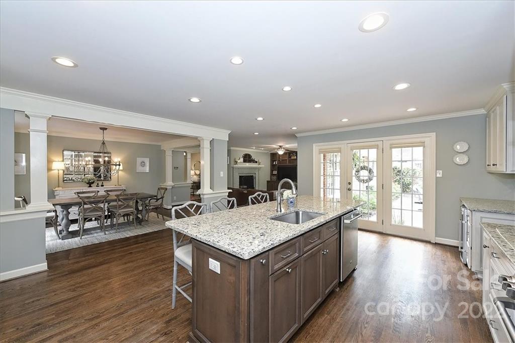 3100 Mountainbrook Road Charlotte, NC 28210 - Photo 24 of 48 a kitchen with a stove and a wooden floor