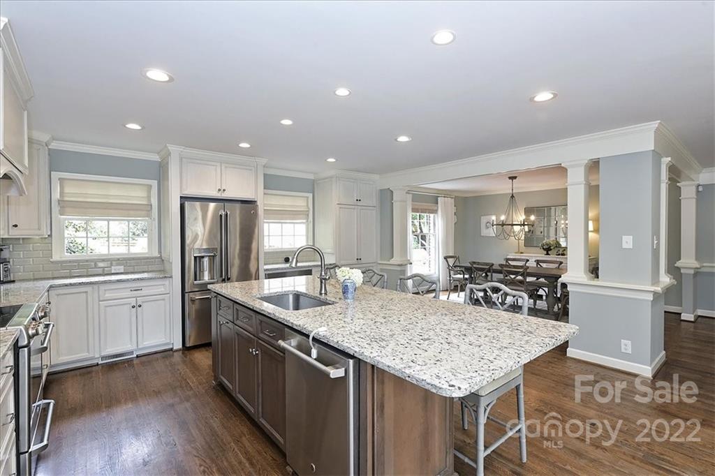 3100 Mountainbrook Road Charlotte, NC 28210 - Photo 25 of 48 a kitchen with granite countertop kitchen island stainless steel appliances a sink and counter space