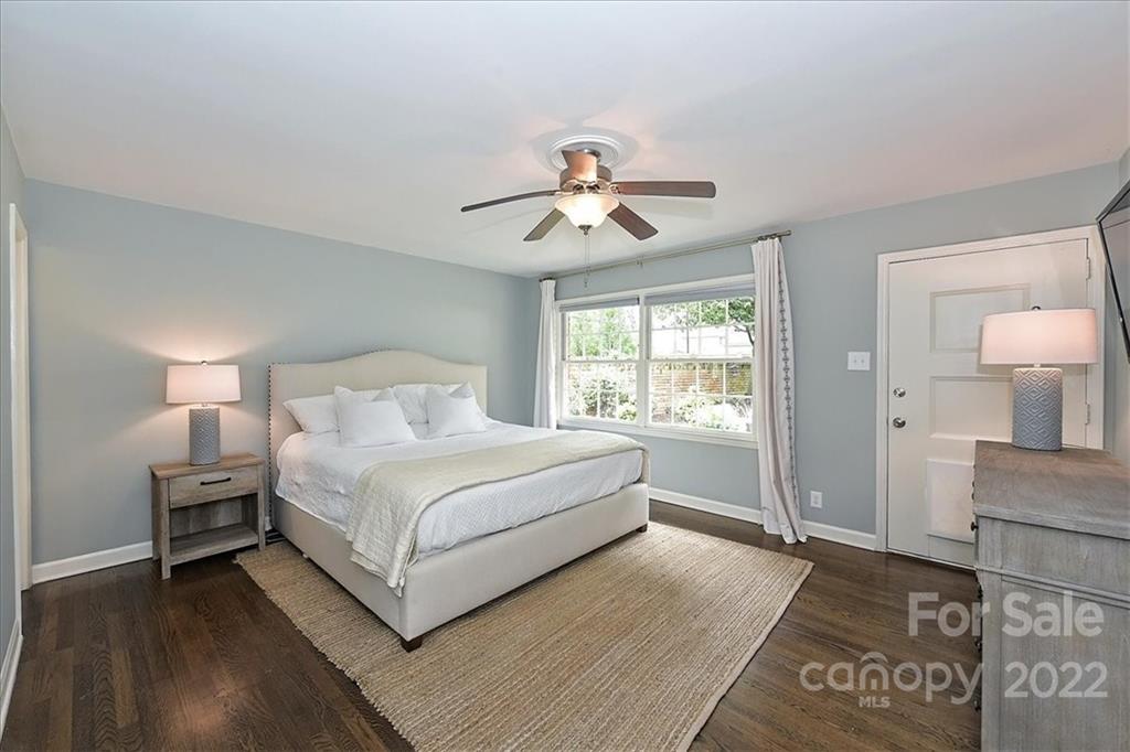 3100 Mountainbrook Road Charlotte, NC 28210 - Photo 29 of 48 a spacious bedroom with a bed and a chandelier