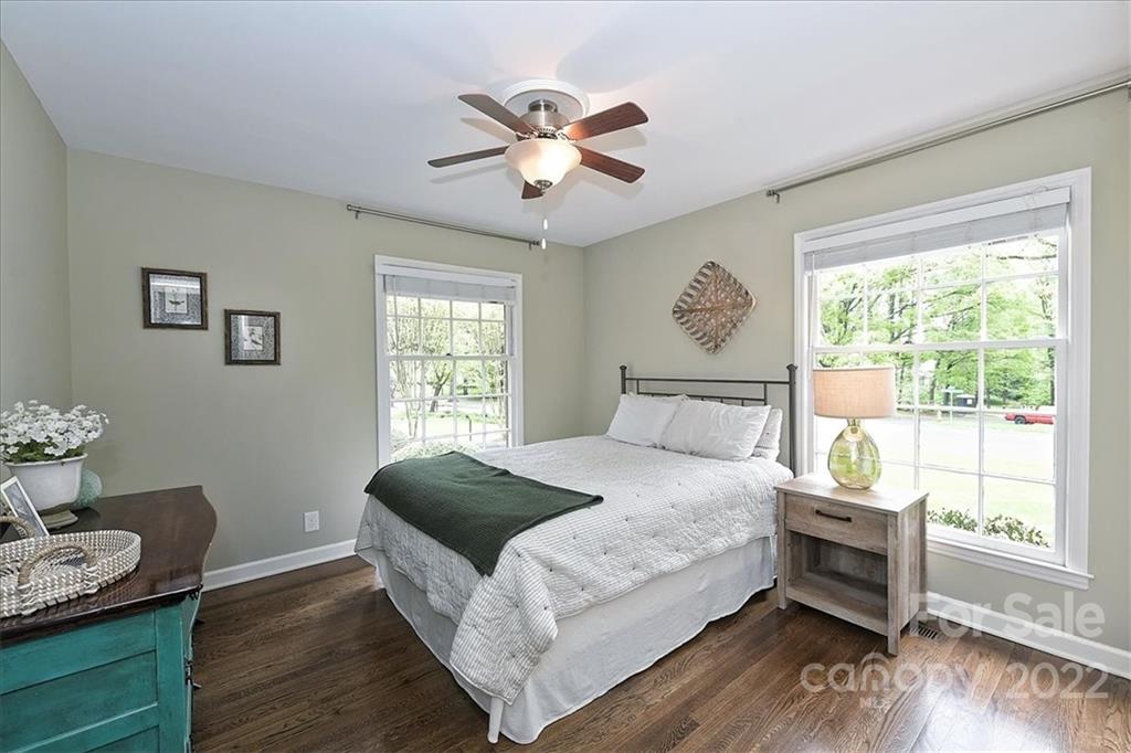 3100 Mountainbrook Road Charlotte, NC 28210 - Photo 36 of 48 a bedroom with a bed and wooden floor