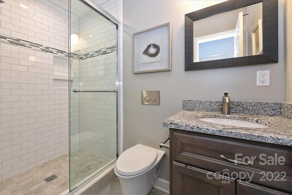 3100 Mountainbrook Road Charlotte, NC 28210 - Photo 37 of 48 a bathroom with a granite countertop toilet sink and mirror