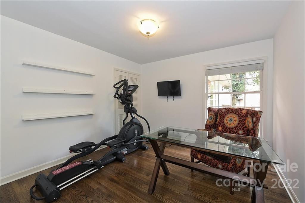 3100 Mountainbrook Road Charlotte, NC 28210 - Photo 39 of 48 a living room with furniture gym equipment and a window