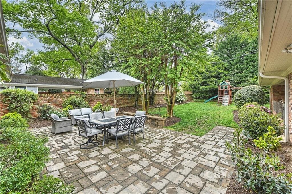 3100 Mountainbrook Road Charlotte, NC 28210 - Photo 40 of 48 a view of backyard with outdoor seating and green space
