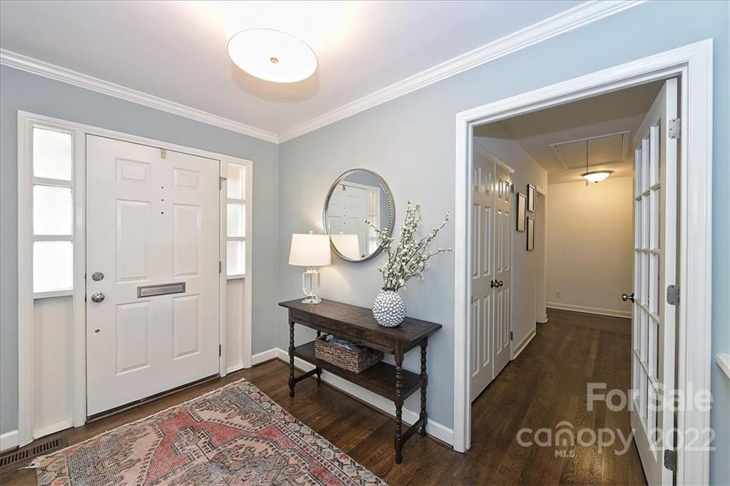 3100 Mountainbrook Road Charlotte, NC 28210 - Photo 4 of 48 a room with wooden floor and a table