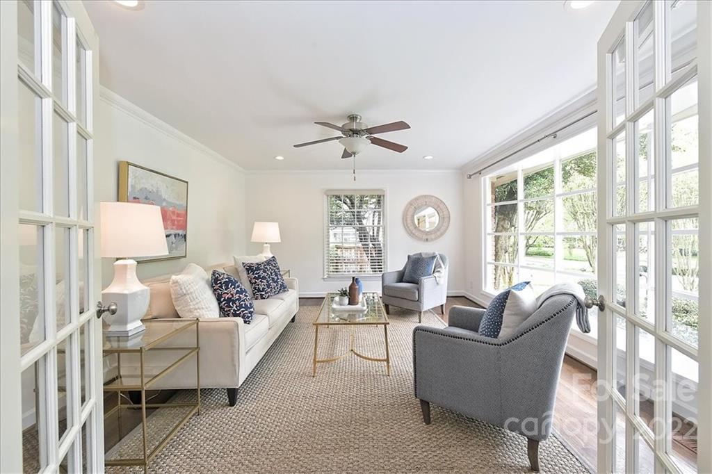 3100 Mountainbrook Road Charlotte, NC 28210 - Photo 8 of 48 a living room with furniture a large window and a chandelier
