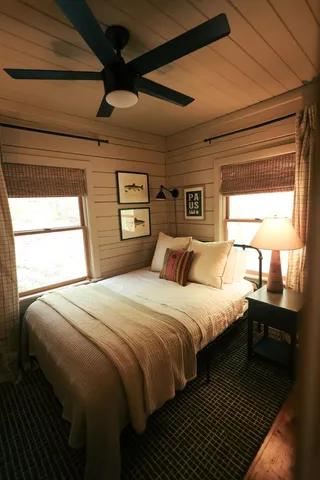 a bed room with bed and window