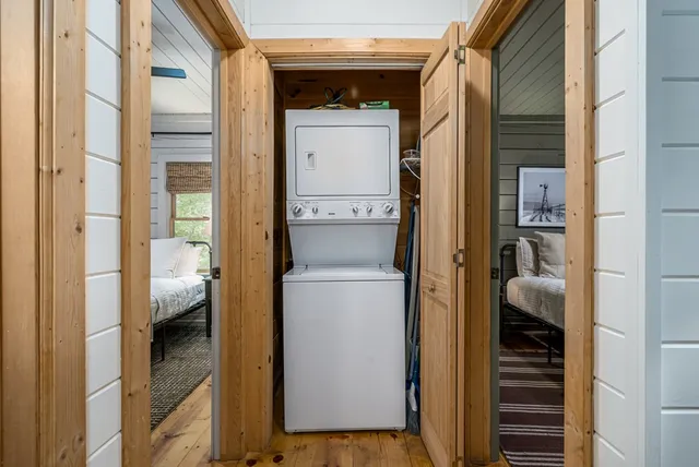 a view of an house with a small deck