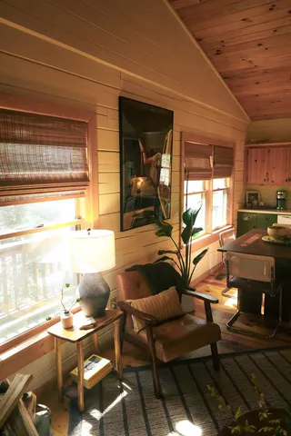a workspace with wooden floor and a table