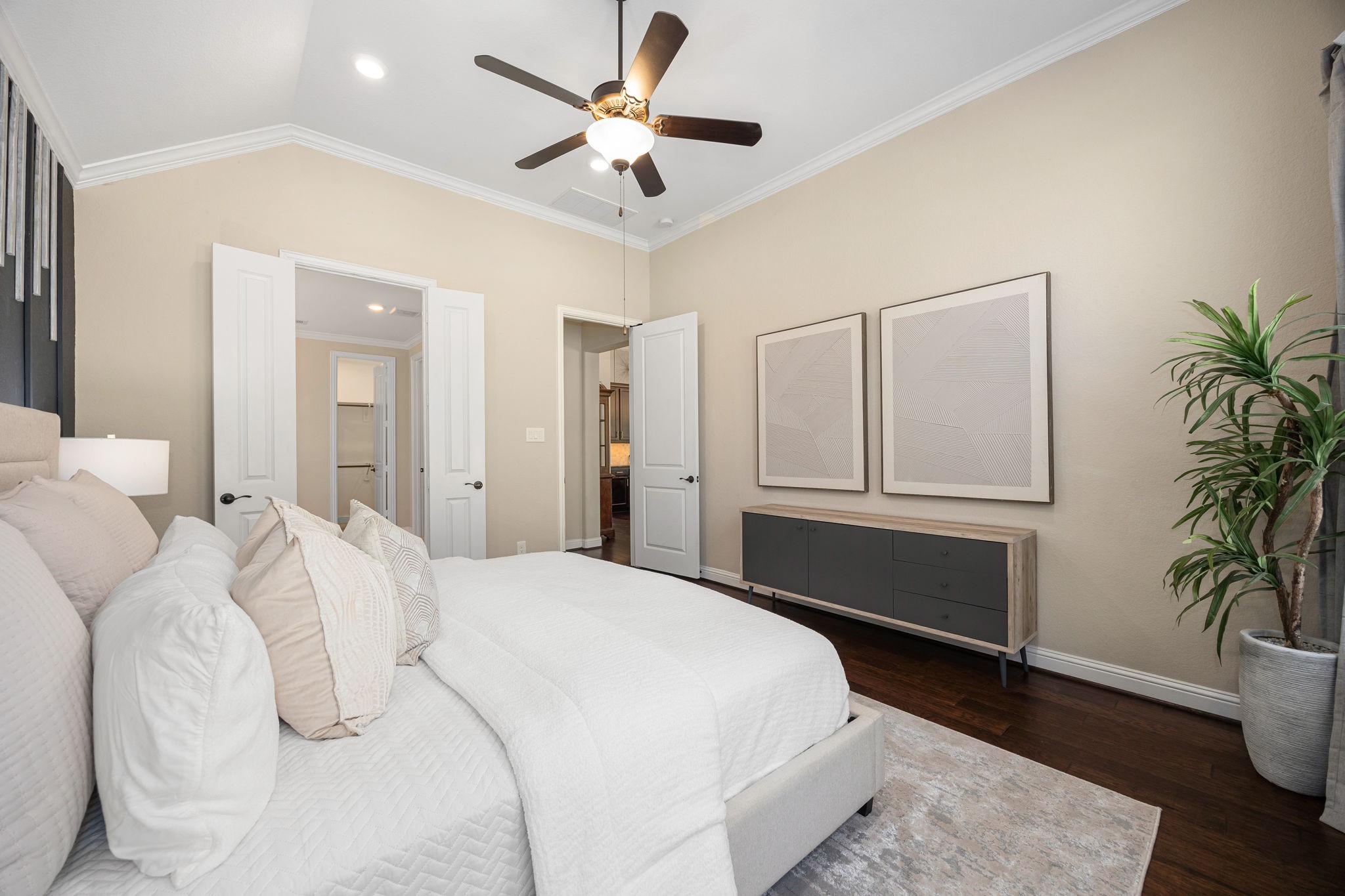 4225 Grand Oaks Wind Spring, TX 77386 - Photo 14 of 40 a bedroom with a large bed and a potted plant